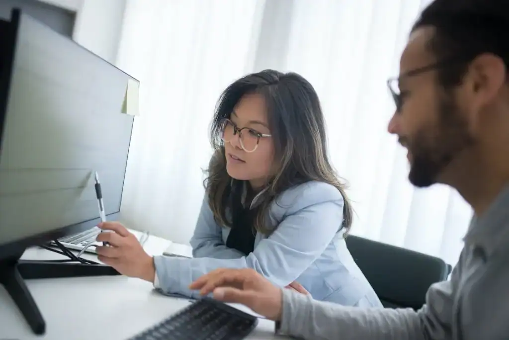 Young woman working on tax documents at home, gig economy tax planning.