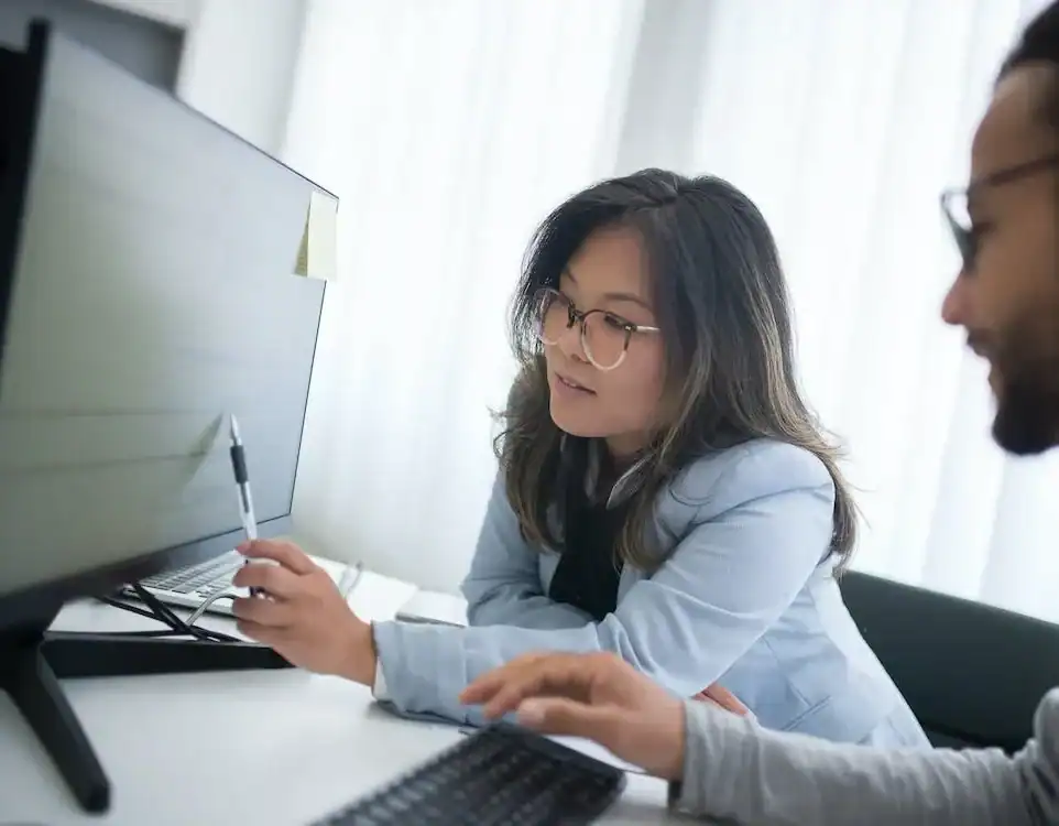 Young woman working on tax documents at home, gig economy tax planning.