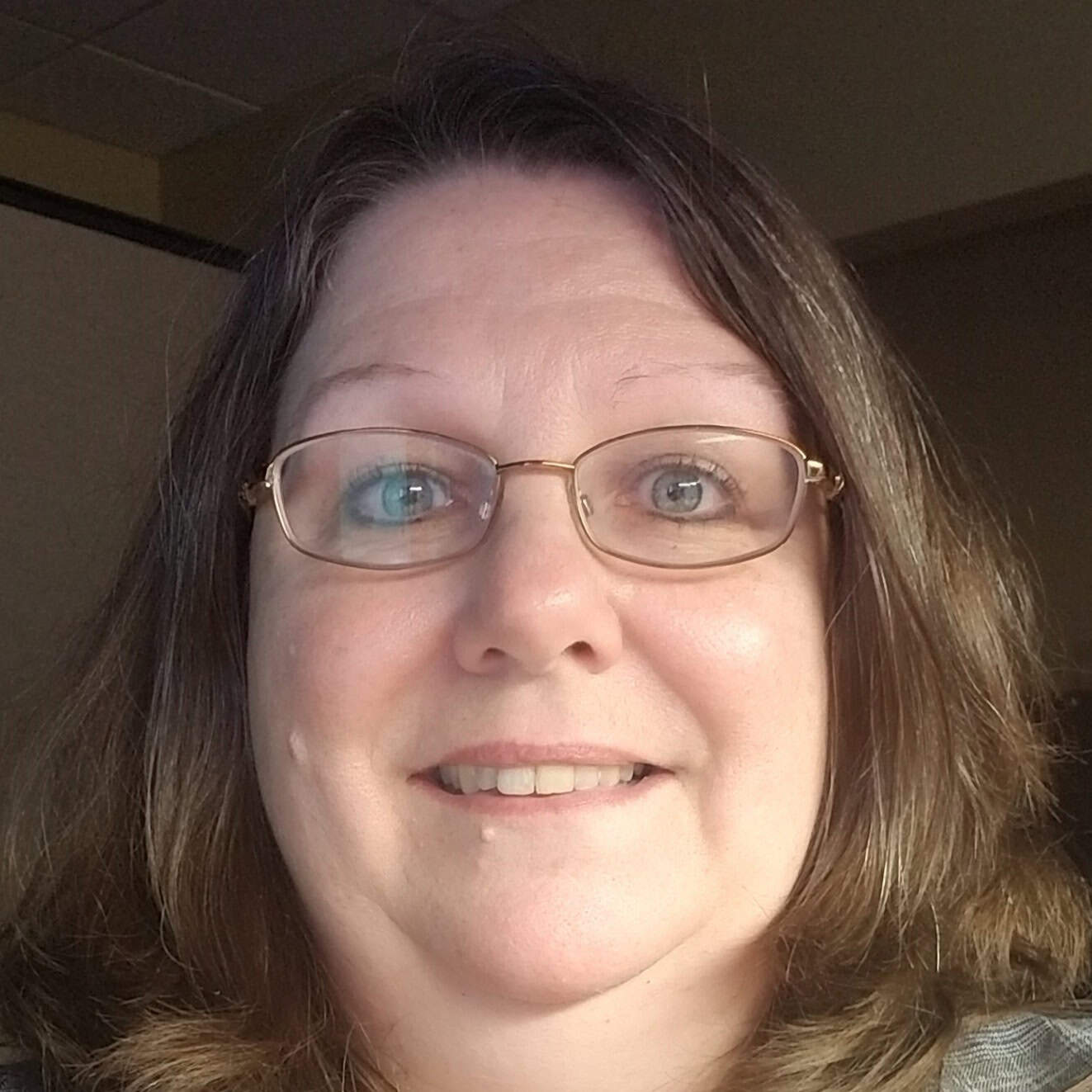 Friendly tax expert with glasses providing tax services at Optimumtaxpro.